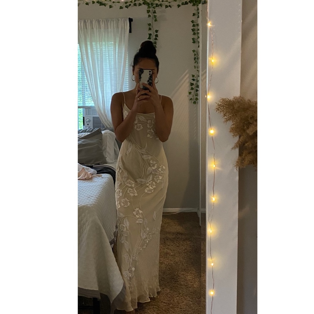 Long beige bedded dress.